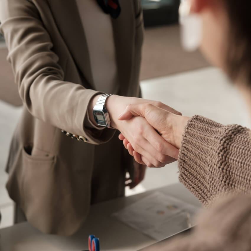 Missoula Property Management client two women shaking hands